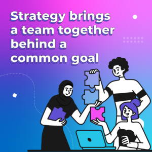 pink, purple and blue background with illustrated people holding jigsaw pieces in front of a laptop with the wording 'strategy brings a team together behind a common goal'