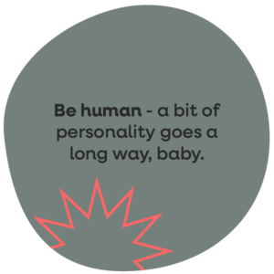 'Be more human - a bit of personality goes a long wa baby' grey green roundel with spiky red graphic